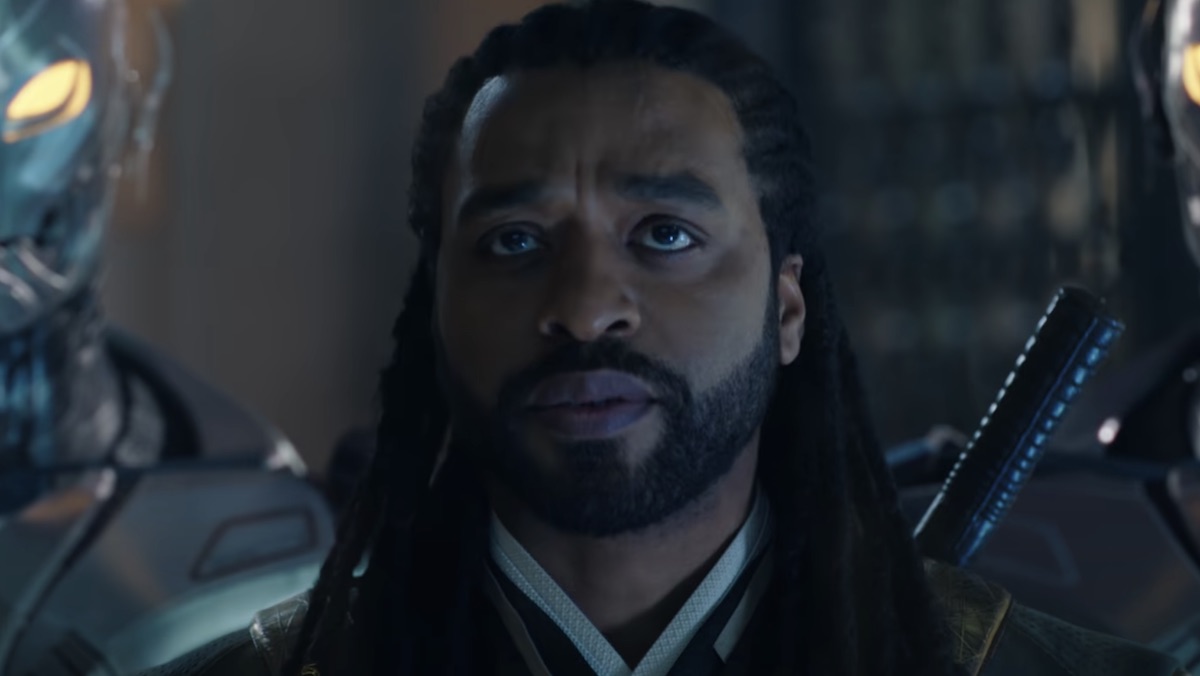 Chiwetel Ejiofor as Baron Mordo surrounded by Ultron guards in Doctor Strange in the Multiverse of Madness. He is one of the MCU Illuminati members.