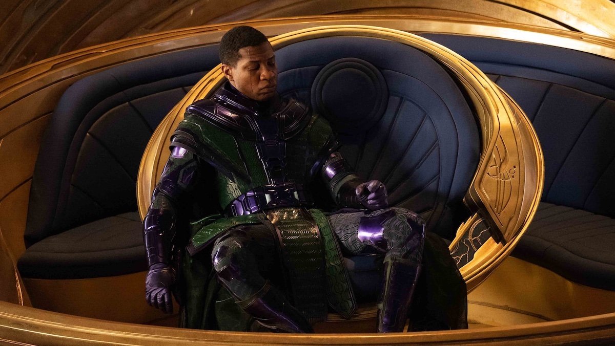 Jonathan Majors' in Kang the Conqueror's suit sits in his multiversal chair